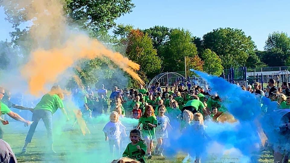 <p>Kids flying through the color</p>

